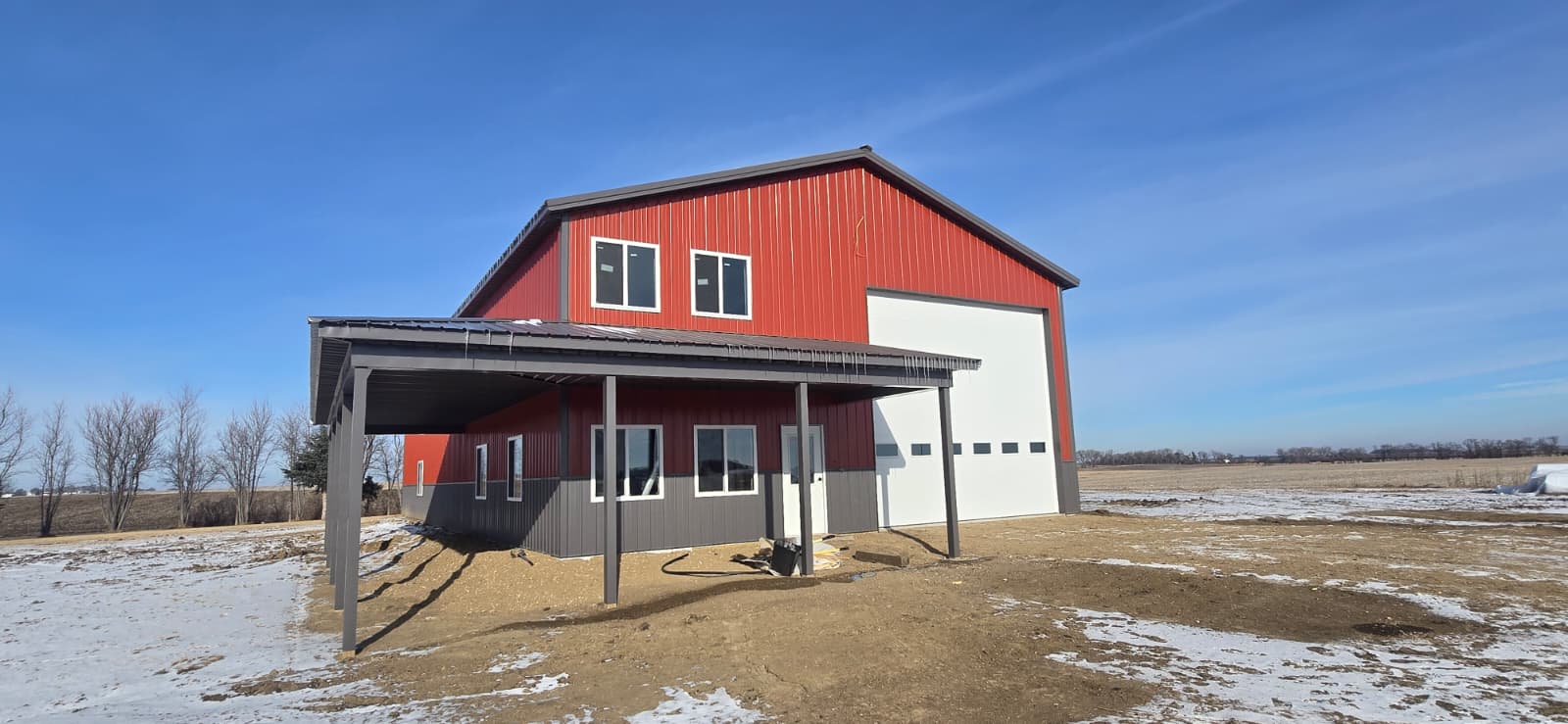 Finished Oakmont red and white barn with covered porch